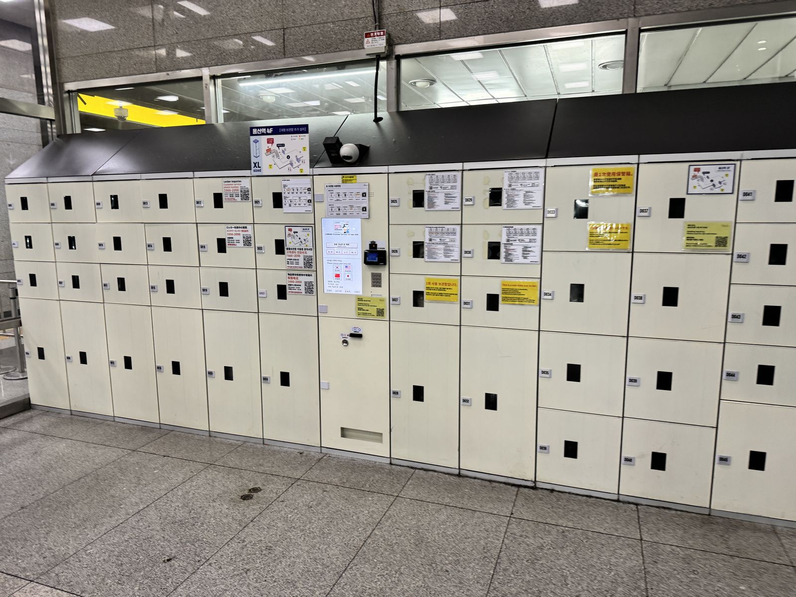 Self-service locker bank with a multilingual kiosk (Korean/English/Japanese/Chinese)